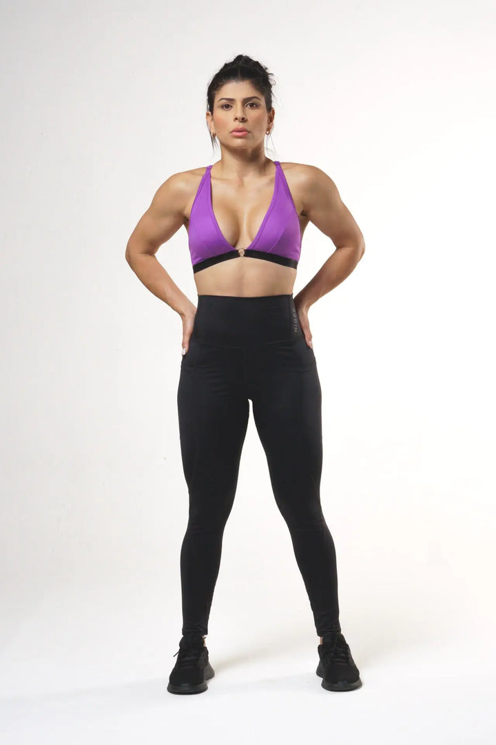 Woman wearing the Nola sport bra adjustable of color royal lilac#color_royal-lilac