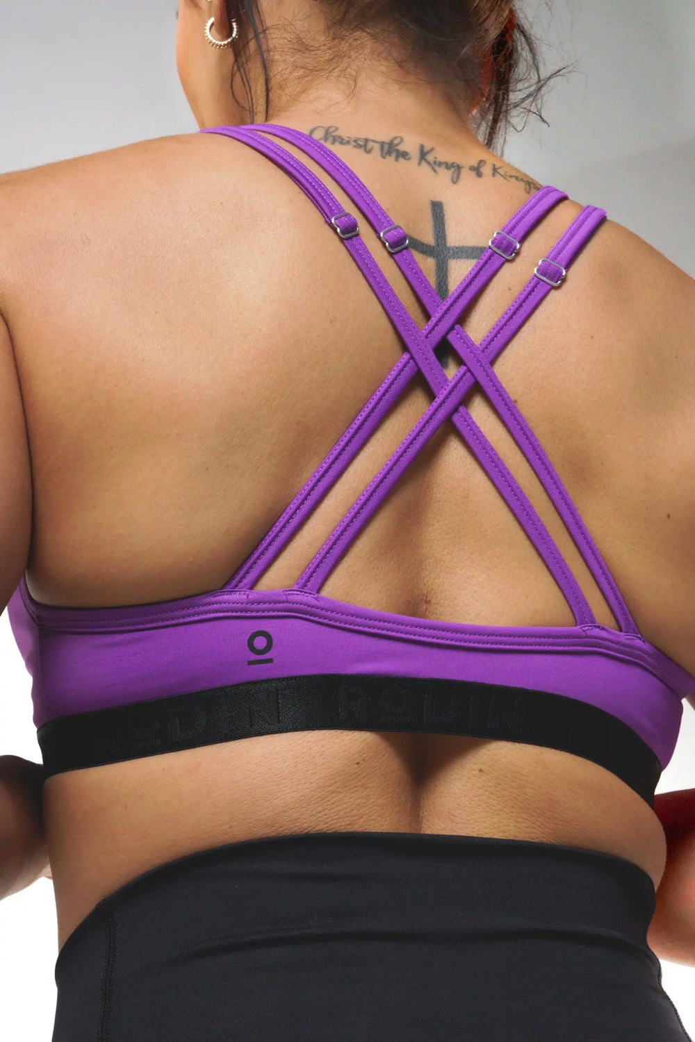 Woman wearing the Nola sport bra adjustable of color royal lilac#color_royal-lilac