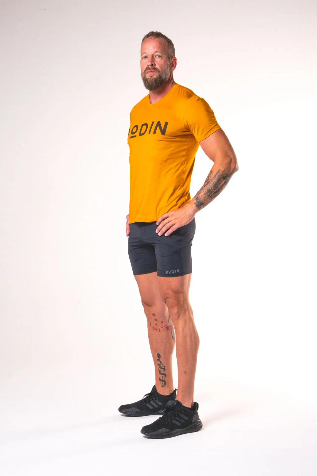 Man wearing the Odin functional athlete tee shirt of color desert sun#color_desert-sun