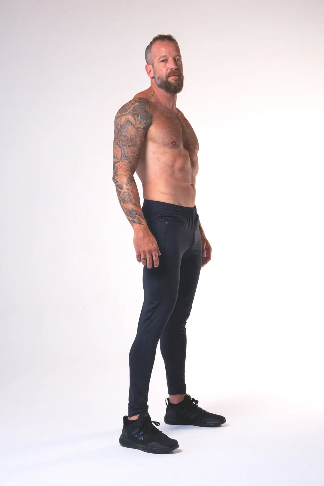 Man wearing the Rogan functional athlete jogger of color black#color_black