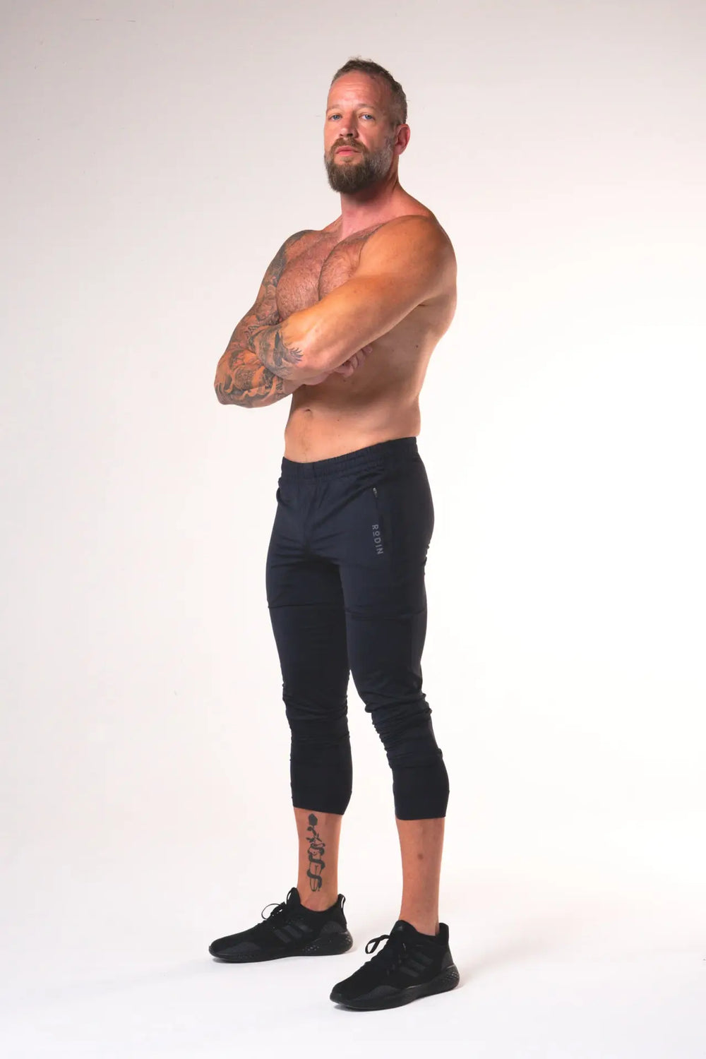 Man wearing the Rogan functional athlete jogger of color black#color_black