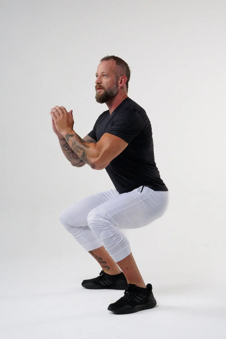 Man wearing the Rogan functional athlete jogger of color white#color_white