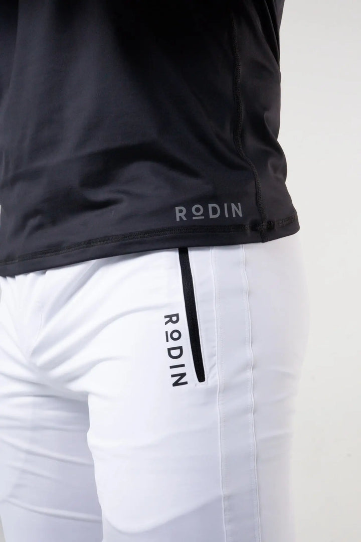 Man wearing the Rogan functional athlete jogger of color white#color_white