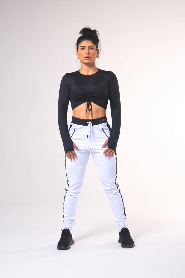 Woman wearing the Shasta functional jogger of color white#color_white