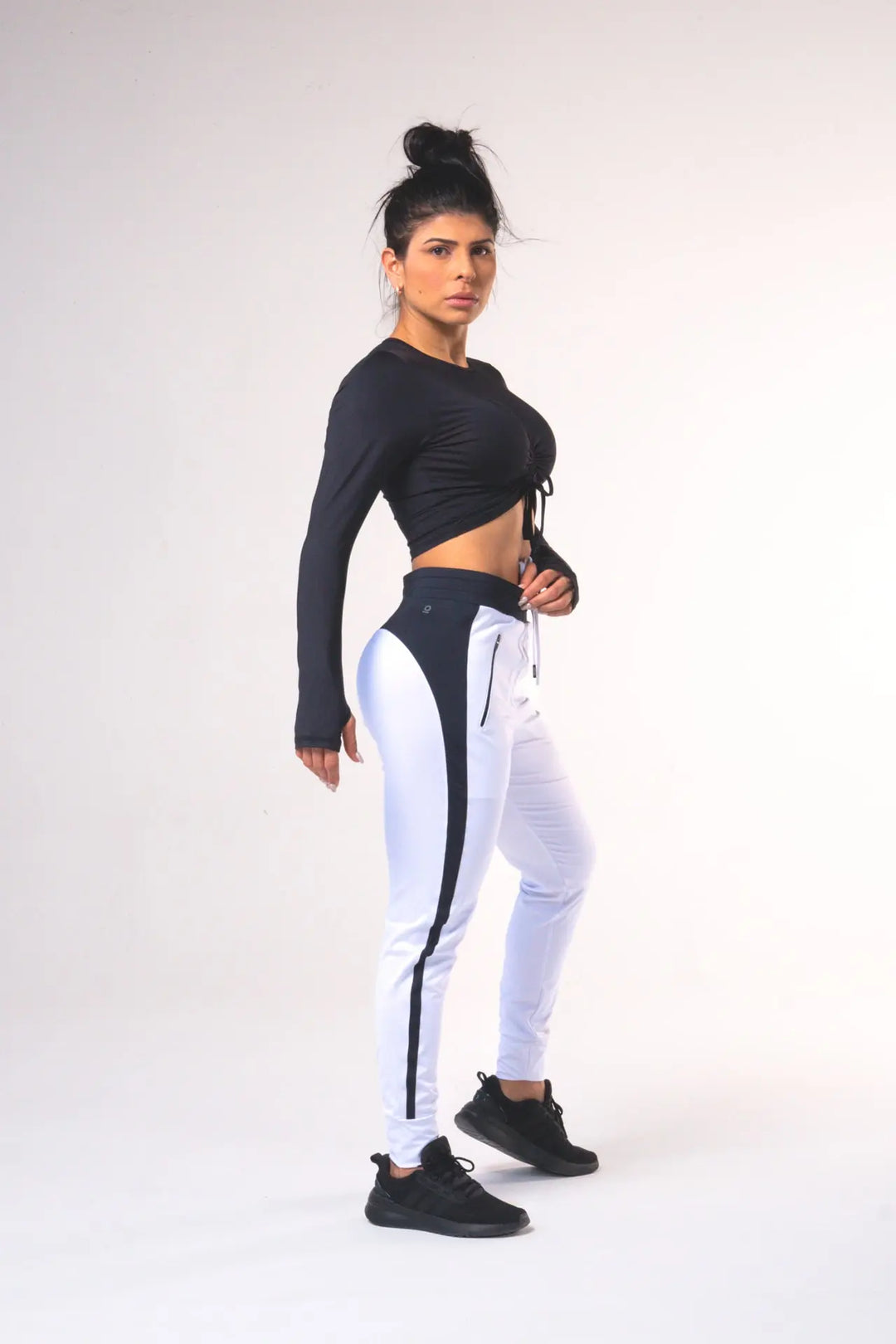 Woman wearing the Shasta functional jogger of color white#color_white