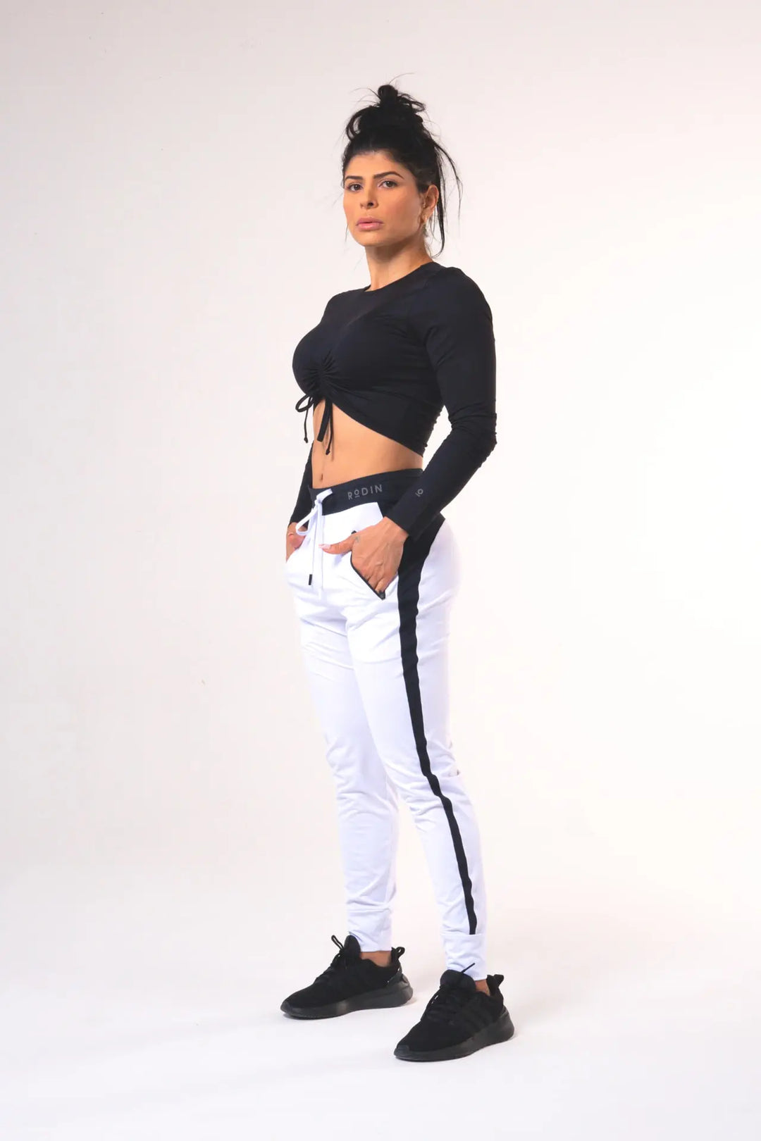 Woman wearing the Shasta functional jogger of color white#color_white