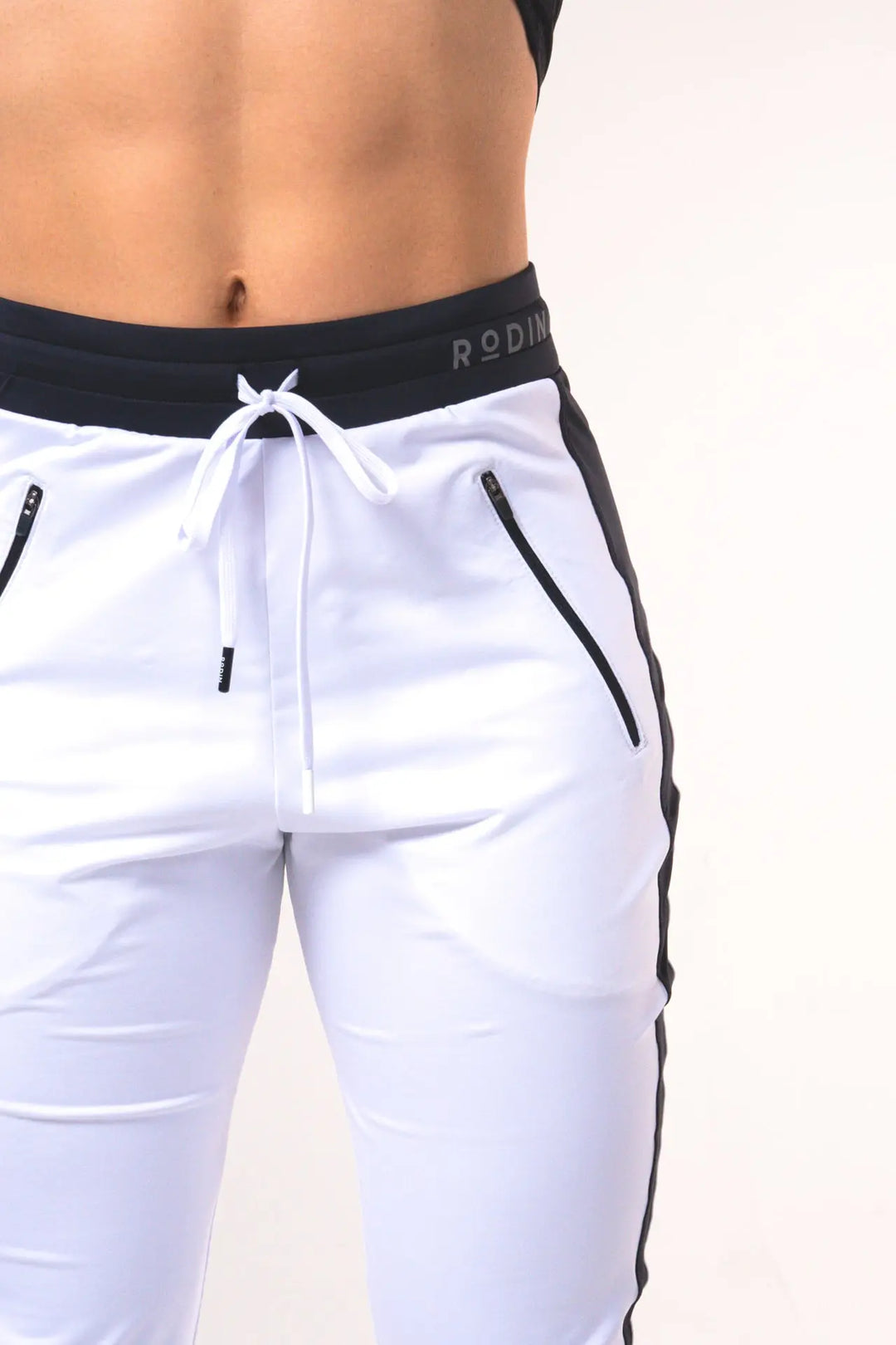 Woman wearing the Shasta functional jogger of color white#color_white