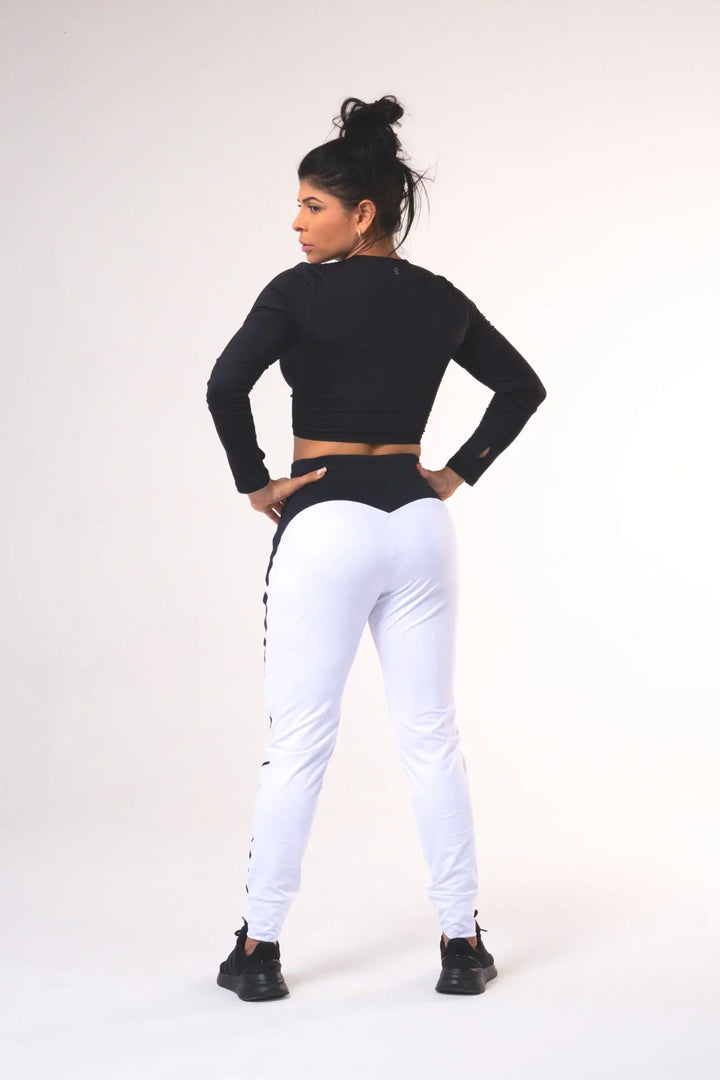 Woman wearing the Shasta functional jogger of color white#color_white