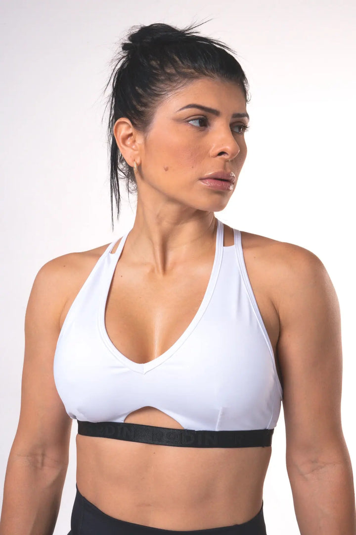 Woman wearing the Shasta adjustable sport bra of color white#color_white